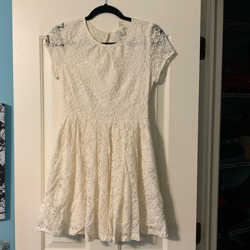 white sundress with floral overlay